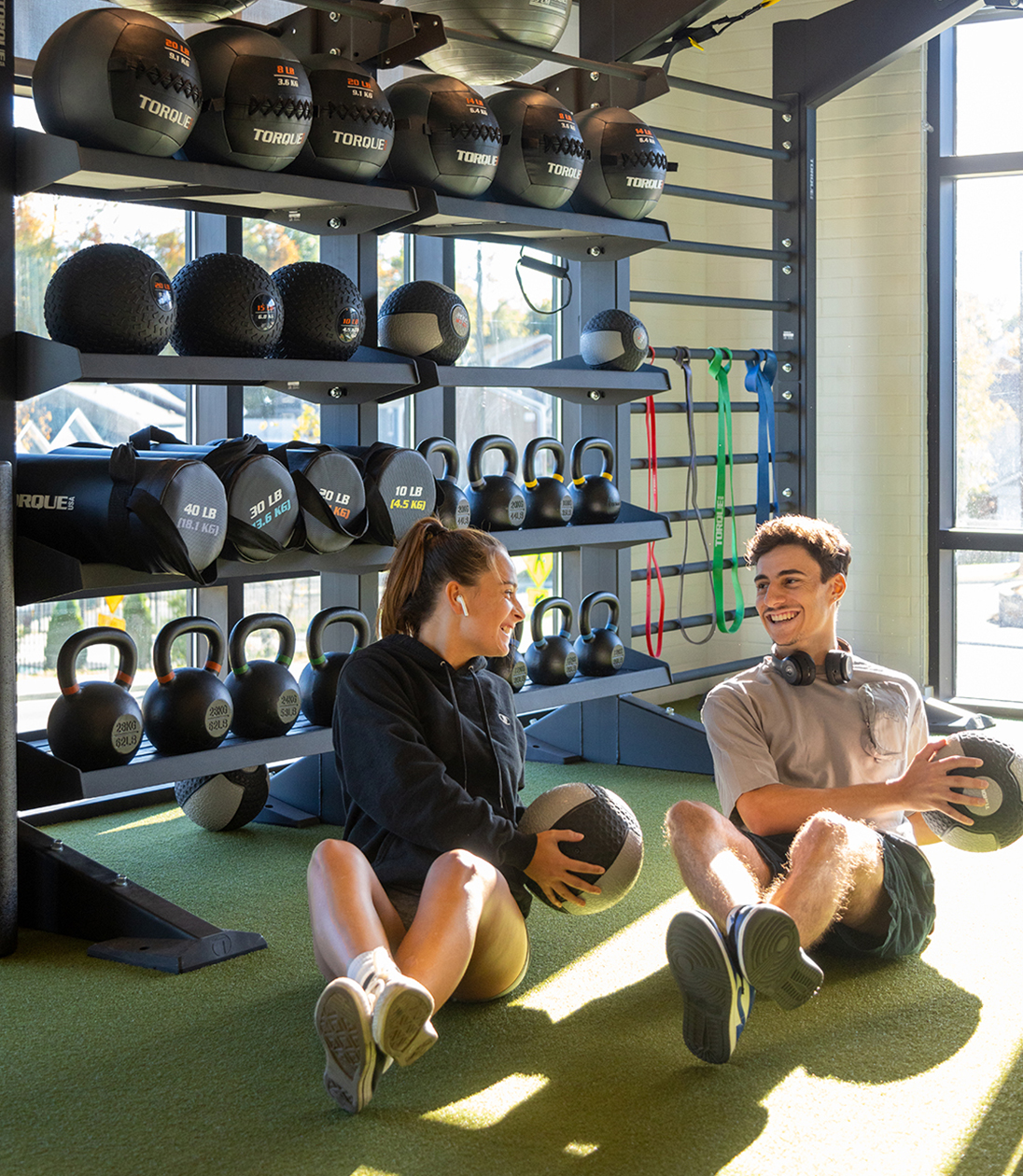 Two people exercising in a fitness center