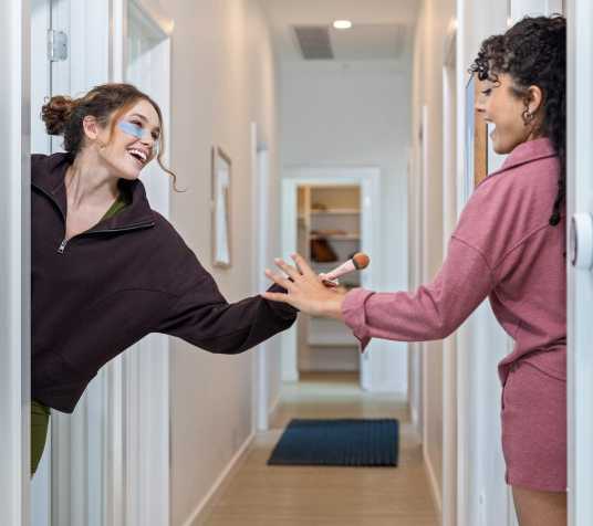 Two people greeting each other