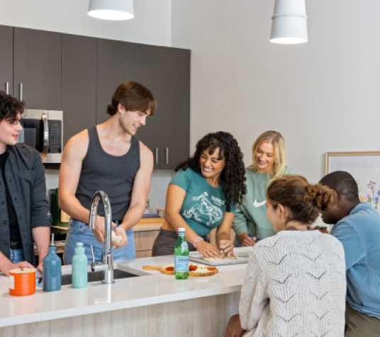 A group of friends cooking together